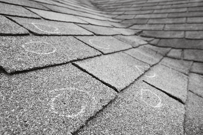 Functional hail damage on asphalt shingle roof in Oklahoma City